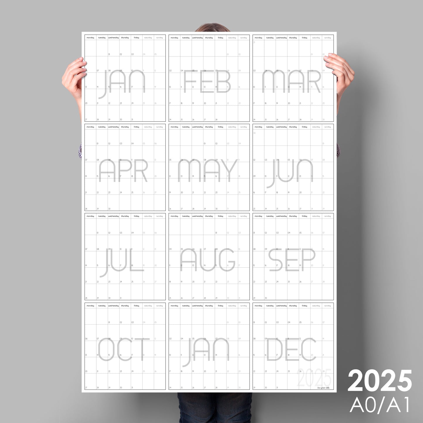 lady holding up giant vertical wall planner