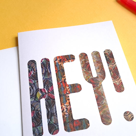 greeting card with the word 'Hey' printed