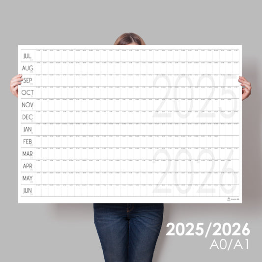 lady holding up extra large wall calendar for 2025/2026