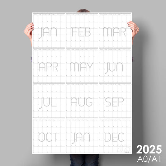 lady holding up giant vertical wall planner