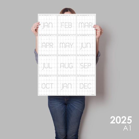 lady holding up vertical wall calendar