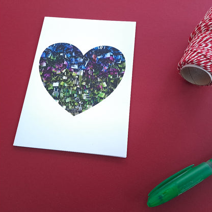 JPG
love heart greeting card against red background