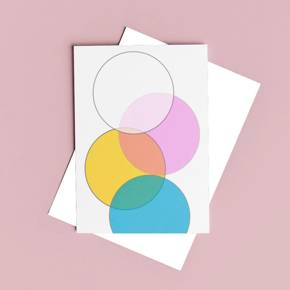 pastel greeting card with geometric shapes against a pink background