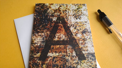 brown greeting card featuring the letter A